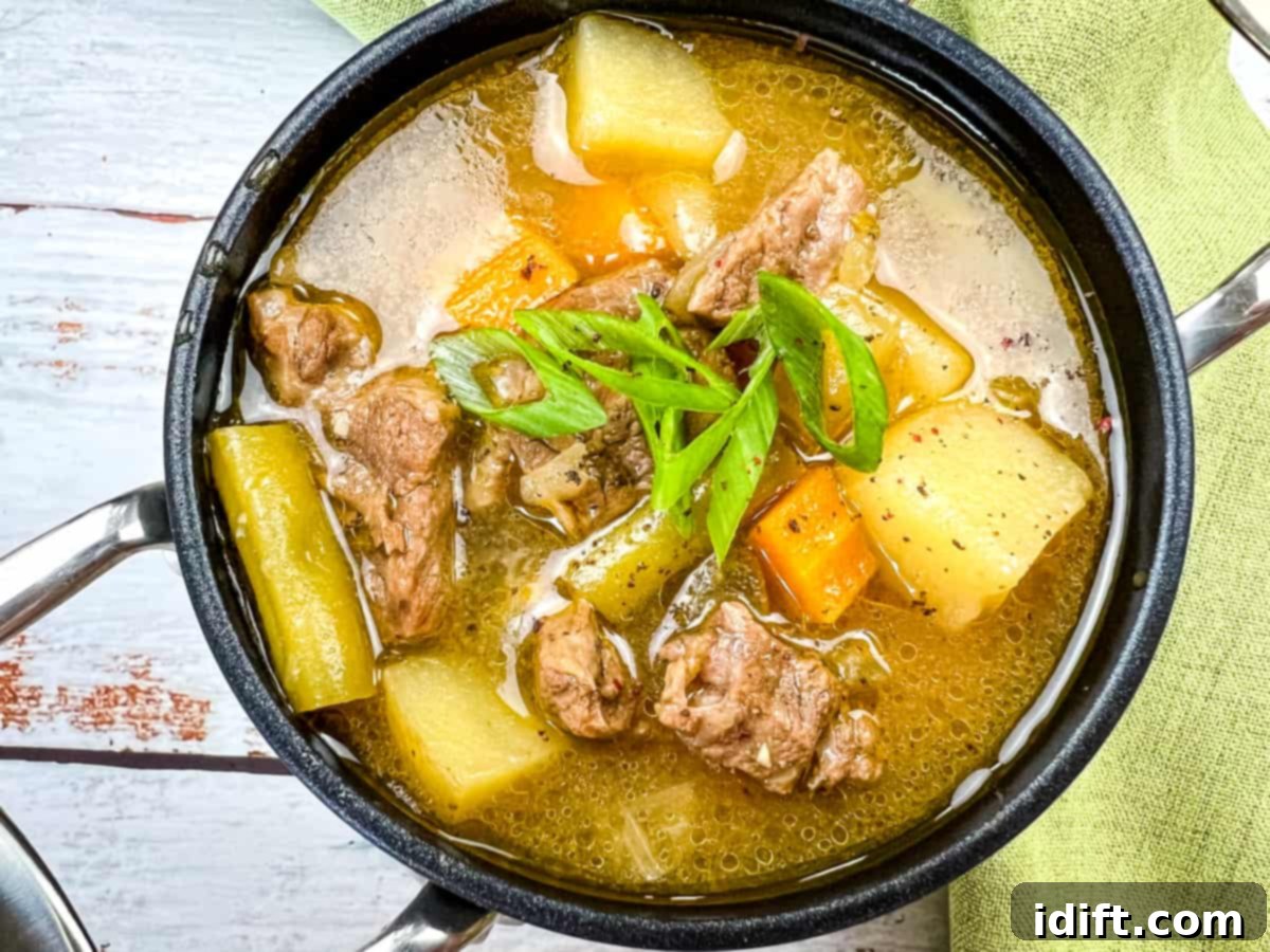 Never Waste a Bite: 19 Genius Recipes for Epic Leftovers 3 Steak & Potato Soup in a black bowl.