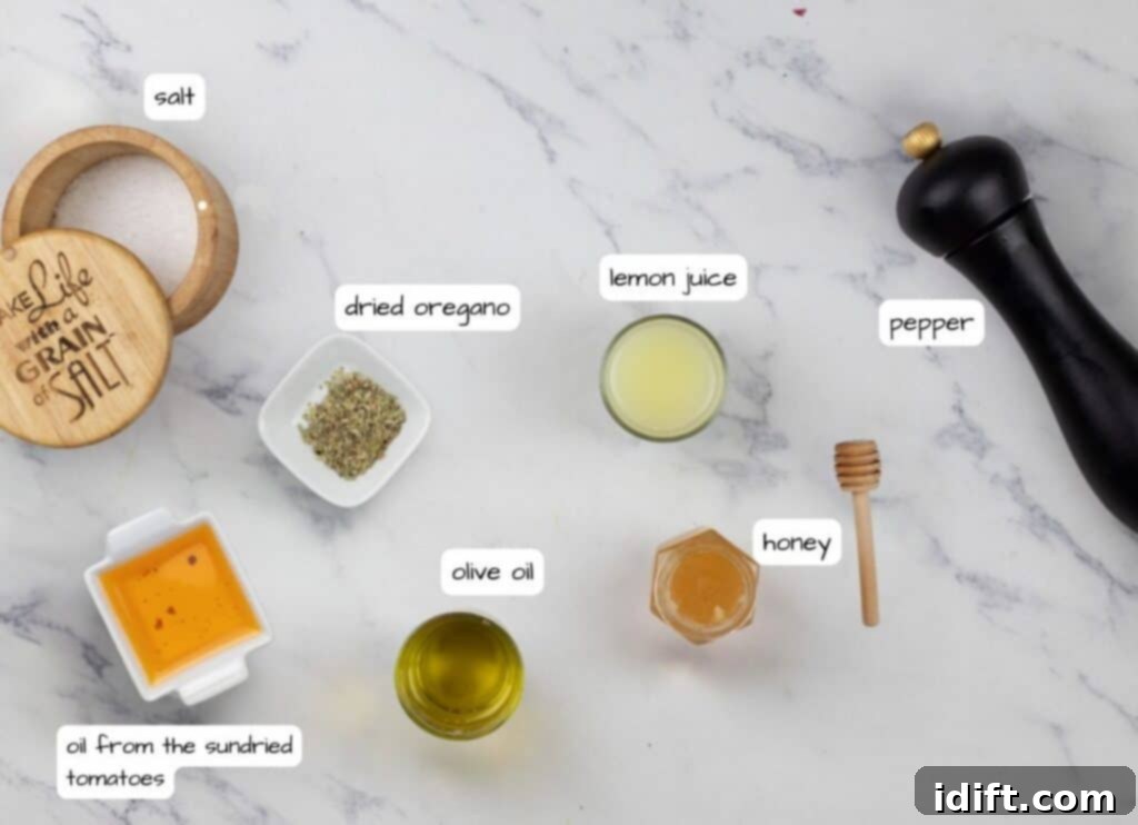 A vibrant collection of ingredients for Mediterranean Orzo Salad with Shrimp, including orzo, feta, various vegetables, and fresh herbs, laid out on a elegant marble surface.