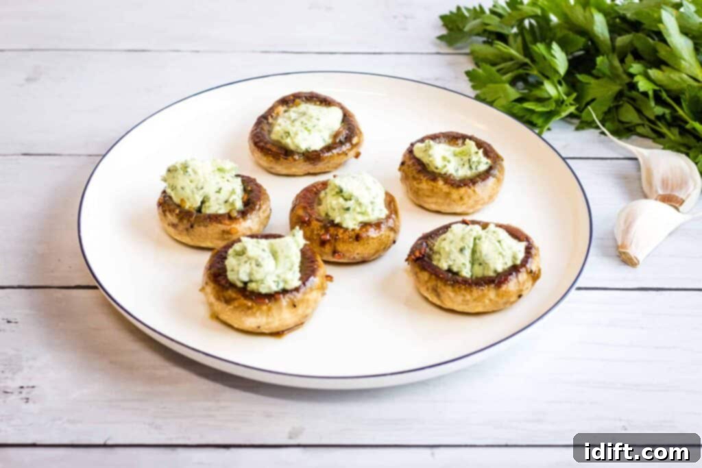 Two flavorful bowls of soup on a table.