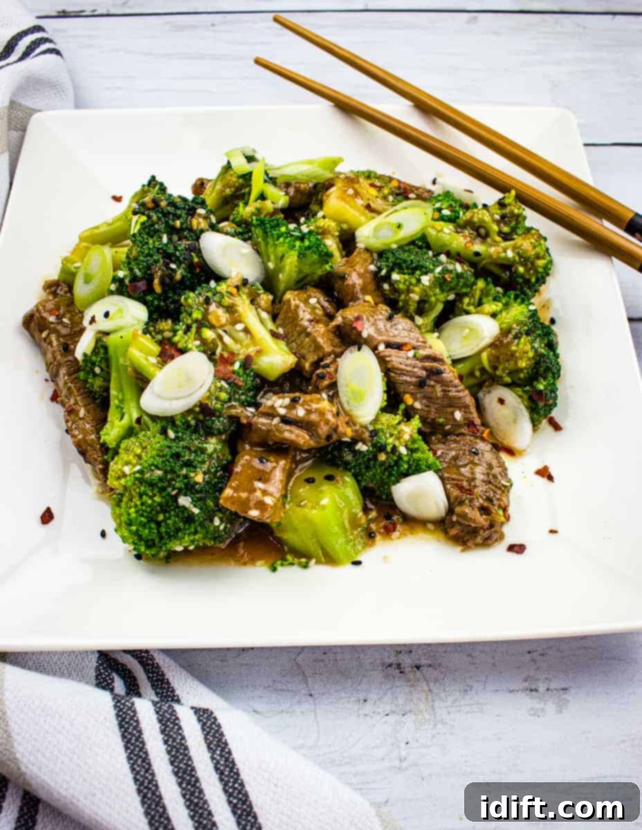 Fast and Flavorful Keto Stir-Fries for Any Night 8 A plate of beef and broccoli with chopsticks.