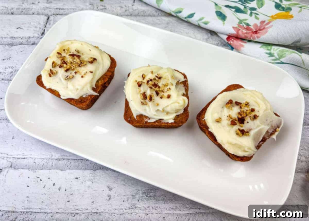 Grandmas Table: 15 Timeless Recipes for Unforgettable Comfort 2 Three mini hummingbird cakes on a white plate, ready to be served as a classic dessert.