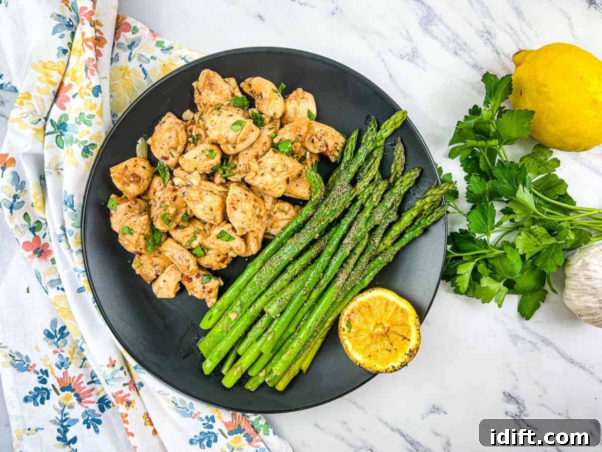Cook Up Joy: Simple Recipes for Little Kitchen Stars 2 A plate of Garlic Butter Chicken Bites with asparagus.