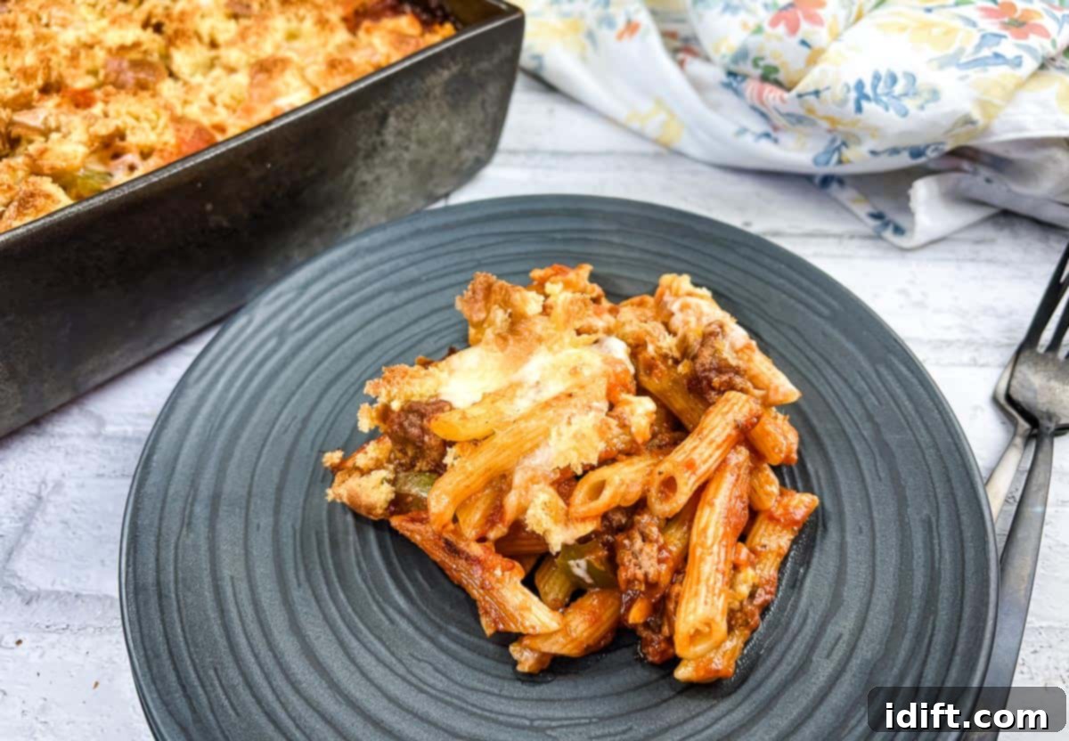 Reclaim Your Time with These Meal Prep Favorites 7 A serving of Sloppy Joe Casserole pasta with meat on a plate with a fork.