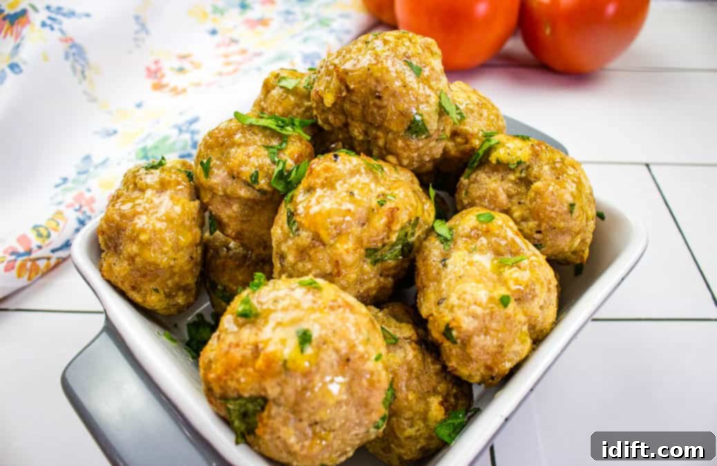 Perfectly golden and crispy Air Fryer Turkey Meatballs served in a white bowl.