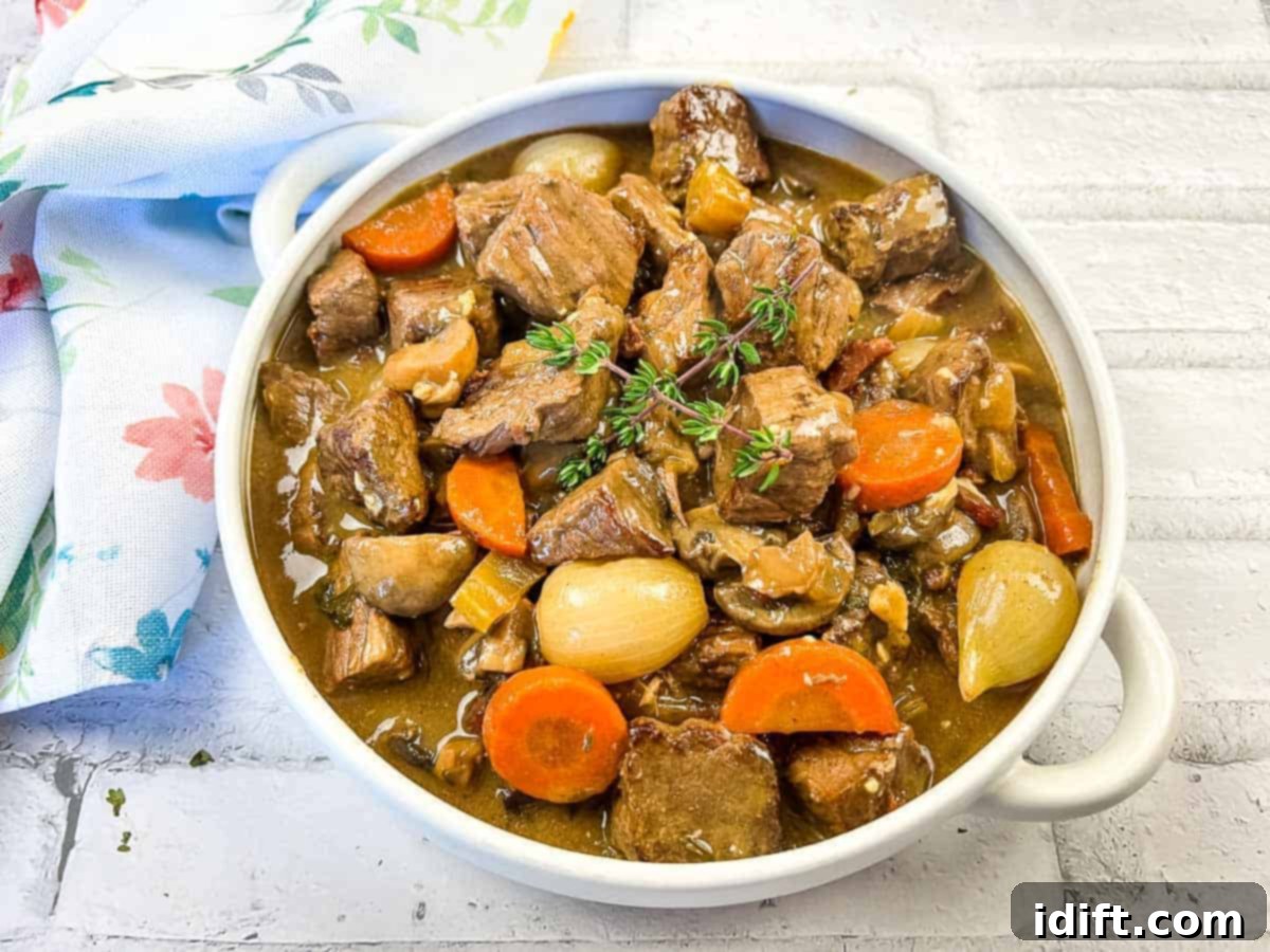 Fresh Start Meals 25 Recipes to Cook From Scratch 5 Beef bourguignon in a white bowl with thyme.
