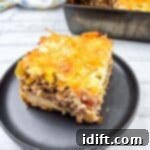 A square of John Wayne Casserole on a black plate.