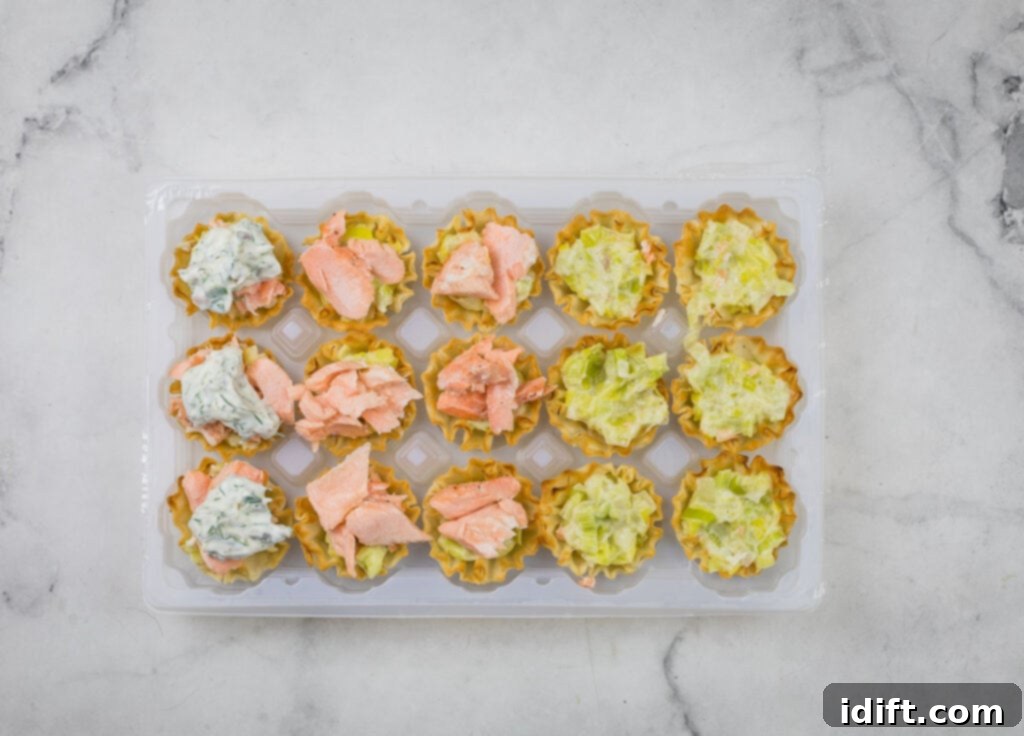 A tray of appetizers with a variety of dips on it.