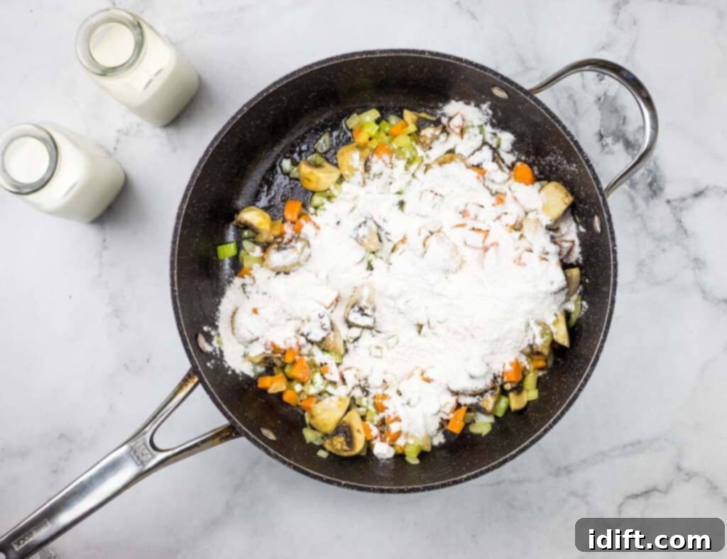 A frying pan filled with vegetables and flour.