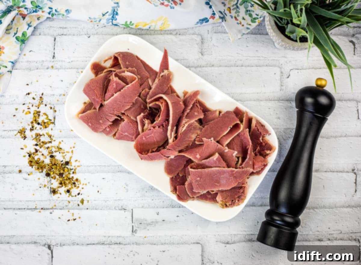 Homemade corned beef on a white plate.