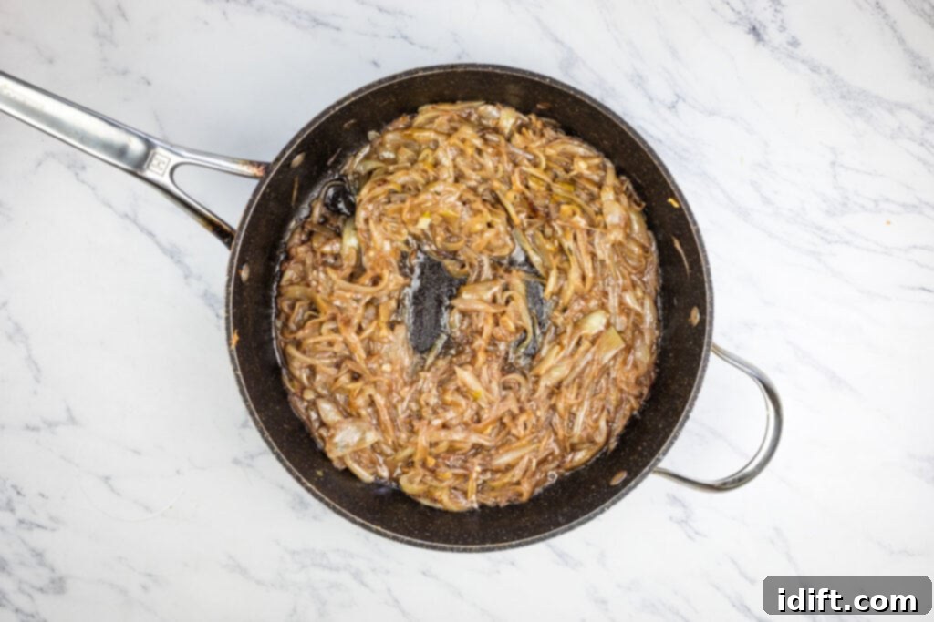 Chef Jenn's Signature French Onion Soup 8 A frying pan with fully caramelized onions, deglazed with red wine.