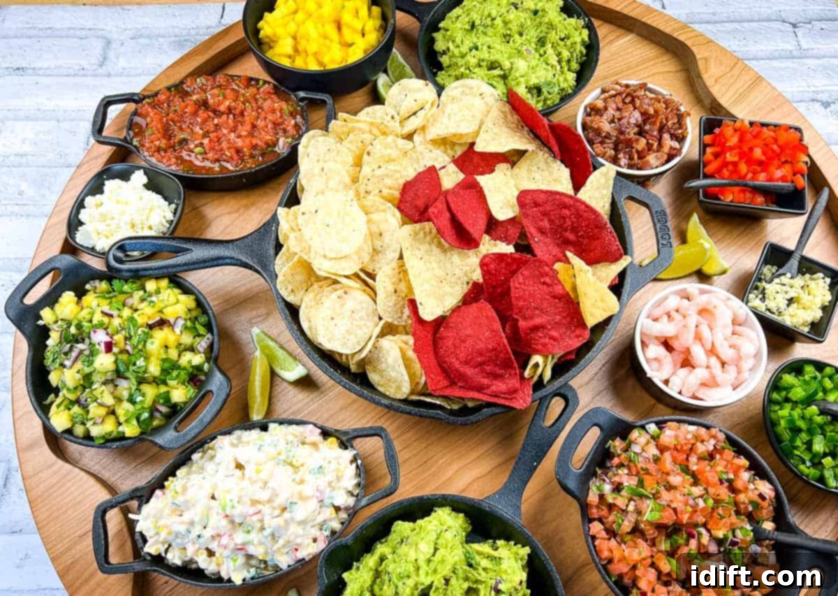 17 Must-Have Dips and Bites That Will Make Your Party Legendary 3 A top-down shot of a guacamole snack board.