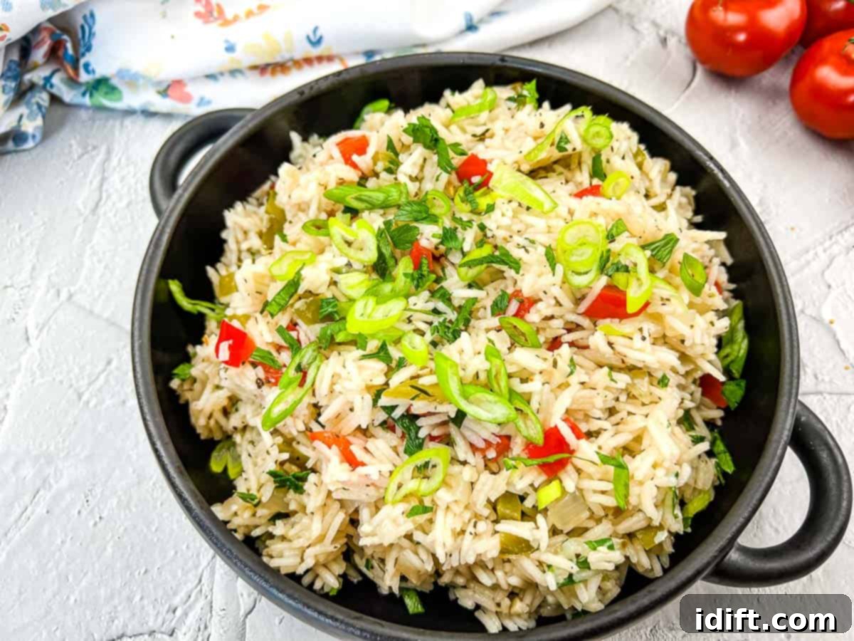 11 Mediterranean Dishes Your Passport to Flavor 2 Flavorful Mediterranean Rice in a sleek black bowl, resting on a rustic concrete surface, garnished with fresh herbs.