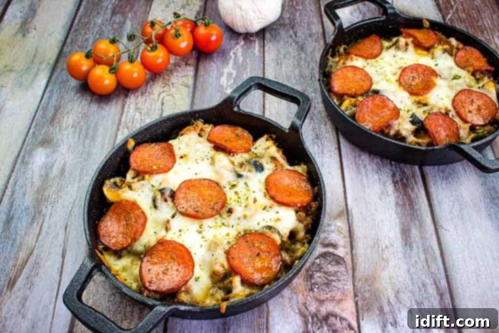 Beyond Boring: 25 Incredible Ground Beef Recipes 2 Two skillets filled with pepperoni and tomatoes, showcasing a rich Pizza Casserole.