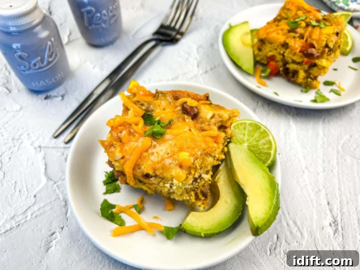Beyond Boring: 25 Incredible Ground Beef Recipes 13 Two servings of rustic Cowboy Cornbread Casserole on individual plates.