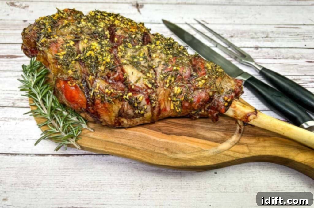 A perfectly smoked leg of lamb, freshly carved into succulent slices on a wooden board, accompanied by a carving knife and fork.