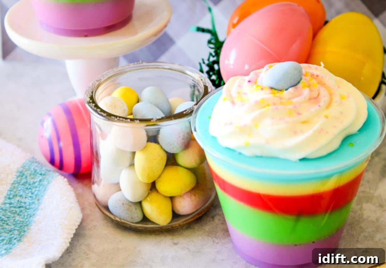 A colorful easter dessert in a cup with eggs and candy.