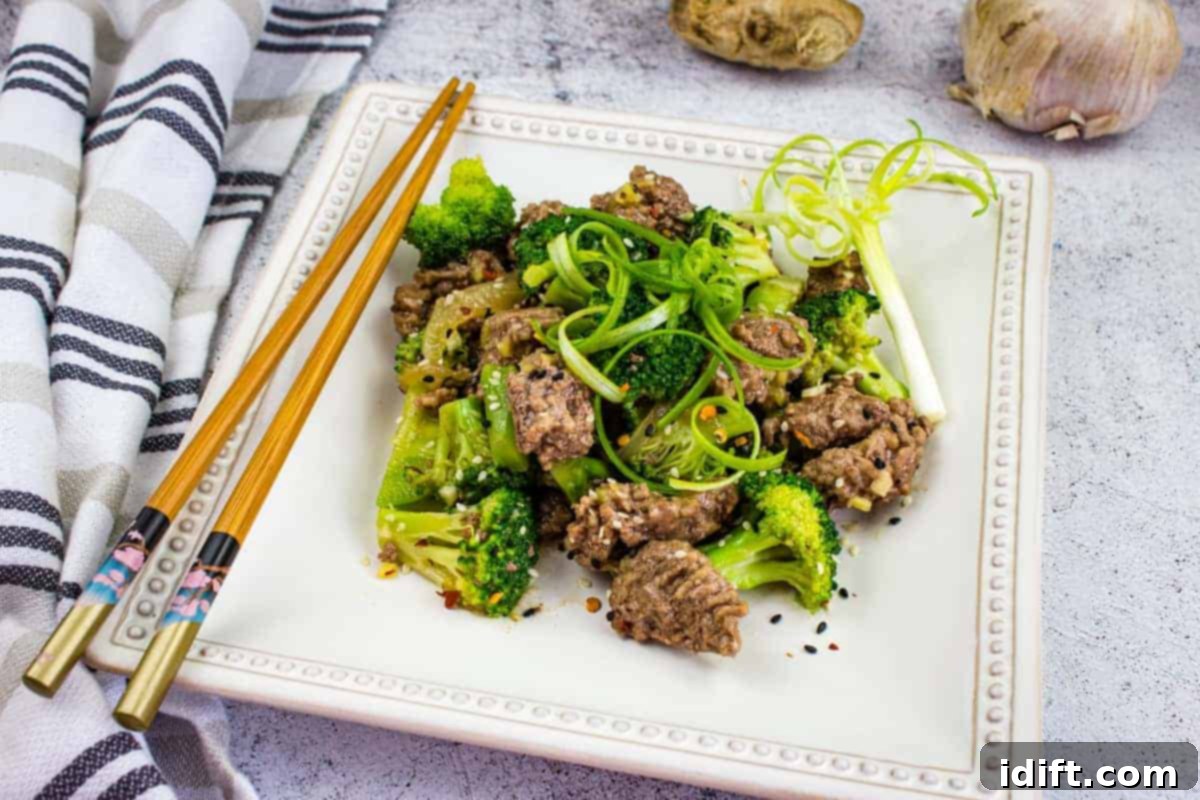 17 Meals for Easy Cleanup 8 A square plate with Beef & Broccoli on it with chopsticks.