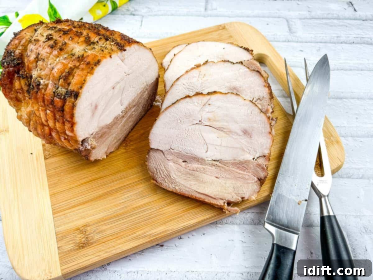 15 Easter Recipes for a Seriously Satisfying Celebration 5 A piece of roasted turkey on a cutting board with a knife.