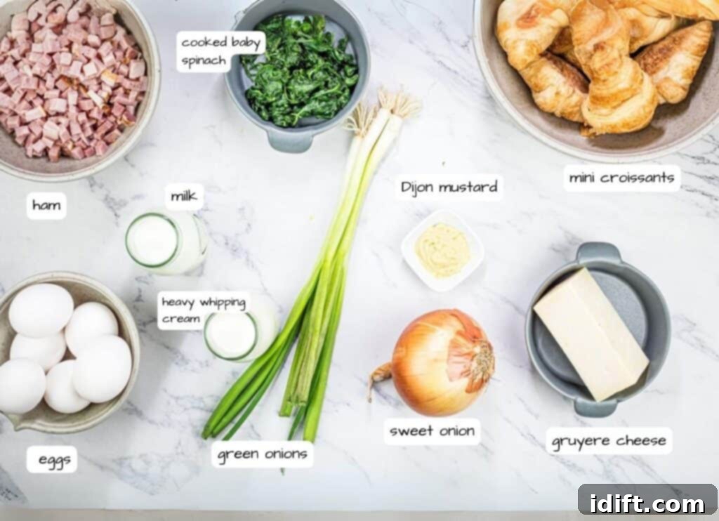Fluffy Croissant Breakfast Delight 4 The ingredients for a breakfast sandwich on a marble countertop.