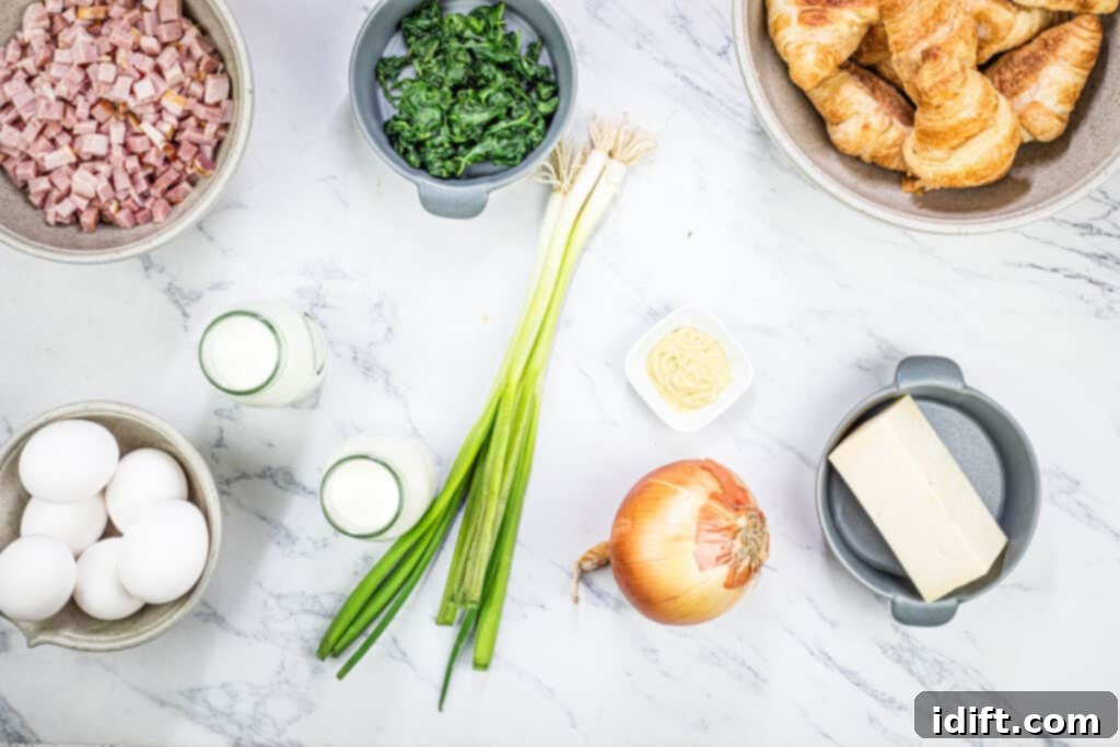 Fluffy Croissant Breakfast Delight 5 The ingredients for a breakfast casserole on a marble table.