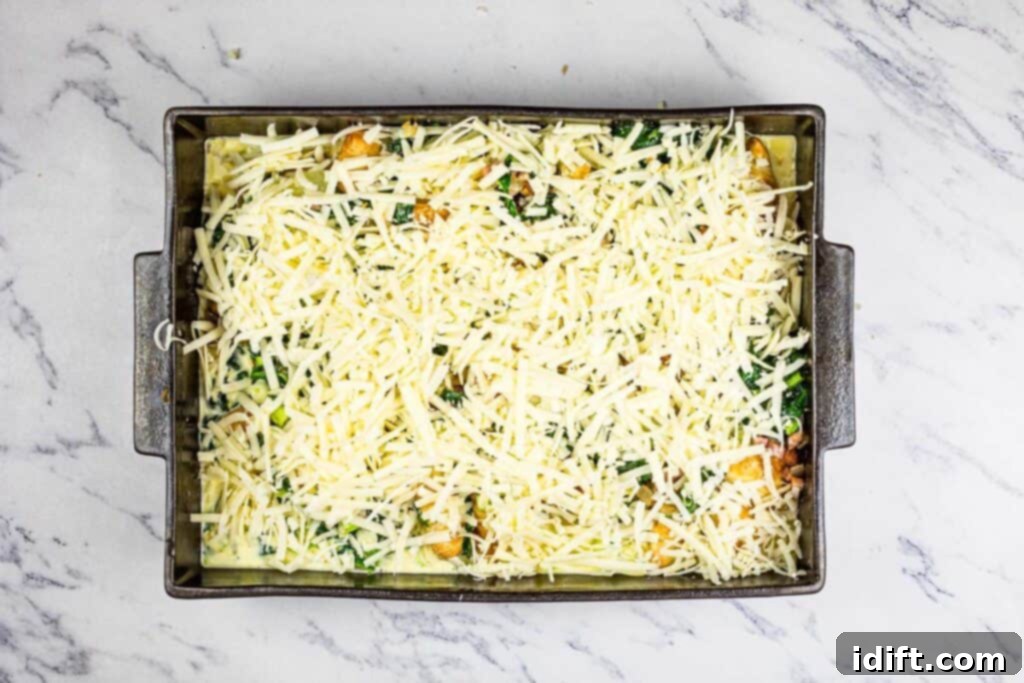 Fluffy Croissant Breakfast Delight 9 A baking dish with cheese and spinach in it.