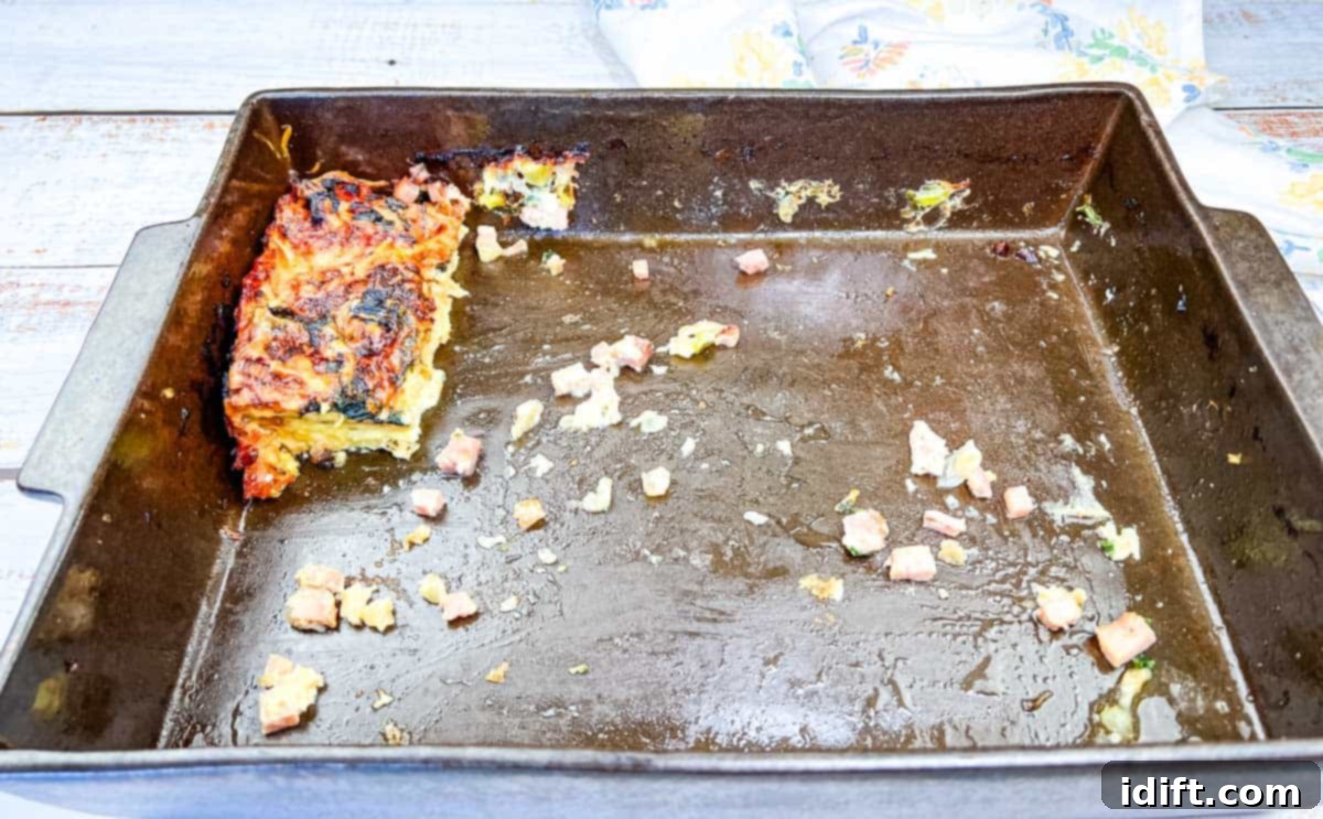 From Grandma's Table: 13 Beloved Recipes That Never Go Out of Style 2 A golden-brown ham and cheese quiche, baked in a pan, ready to be served from Grandma's recipe.