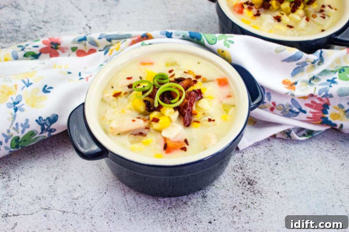 From Grandma's Table: 13 Beloved Recipes That Never Go Out of Style 8 Two cozy bowls of Chicken & Corn Chowder on a rustic table, a comforting classic from Grandma's kitchen.