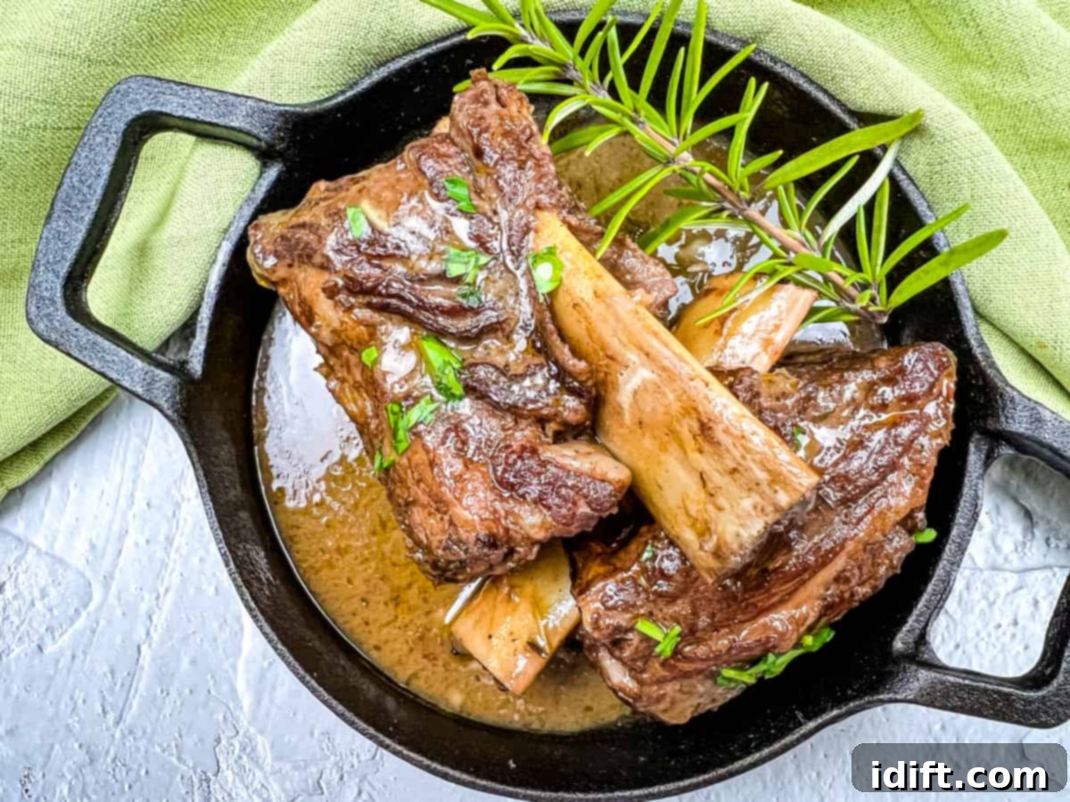 Luxurious garlic braised beef short ribs served with rich gravy and creamy mashed potatoes.