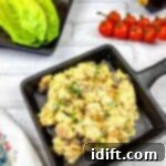 Regal Curried Chicken Salad 10 A skillet with eggs, tomatoes and lettuce on a white background.