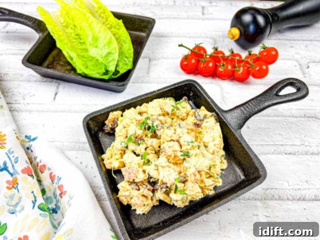 Regal Curried Chicken Salad 8 A black skillet with a salad in it.