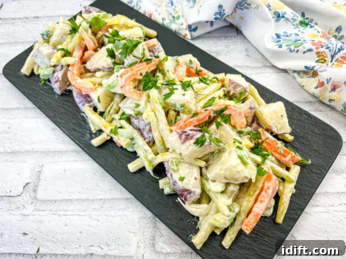 The Ultimate Potato Playbook 15 Recipes For Every Taste Bud 6 A vibrant bowl of Yellow Bean and Potato Salad, featuring tender beans and potatoes tossed in a light dressing.