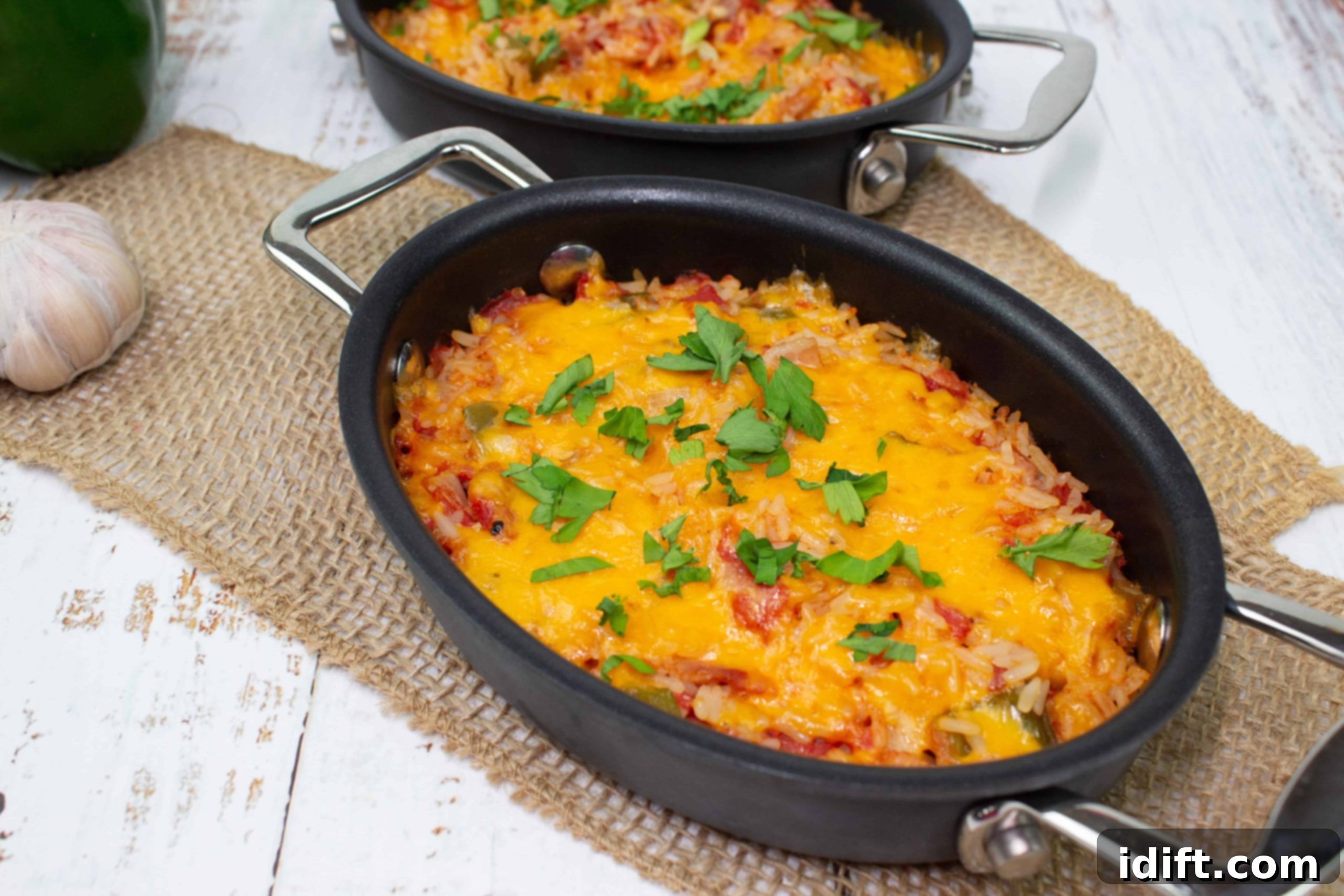 A closeup of Baked Spanish Rice in a black dish, highlighting vibrant colors and textures for an easy weeknight meal.