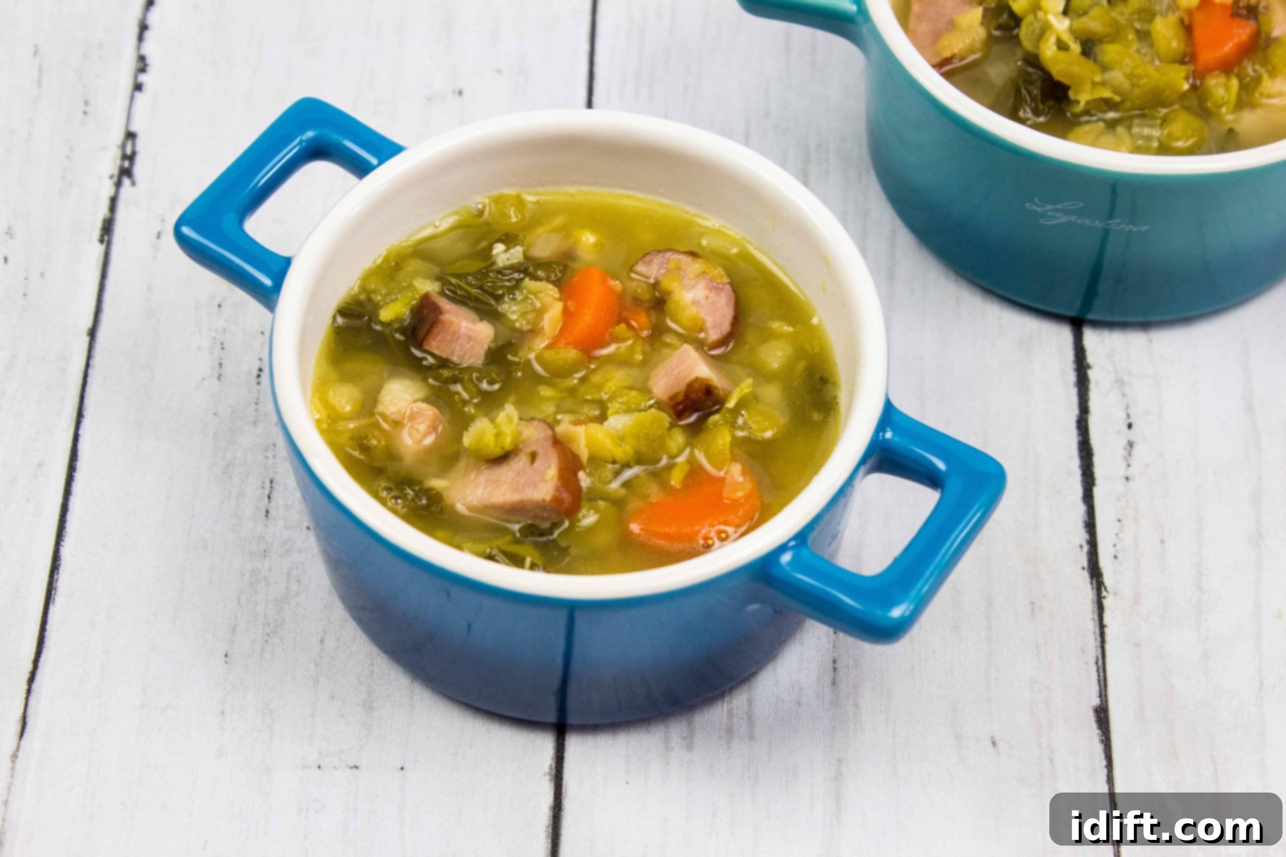 Spoonfuls of Bliss: 17 Hearty Soups for Cozy Comfort 5 Two bowls of savory Split Pea, Ham & Sausage Soup, rich with vegetables and meat.