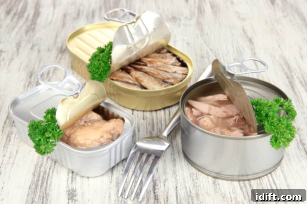 The Ever Ready Pantry Canned Food Essentials 2 Three canned goods open on a wooden table.
