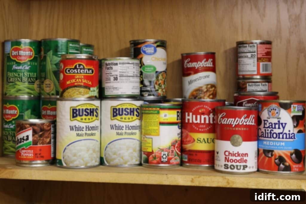 The Ever Ready Pantry Canned Food Essentials 5 A shelf with cans of food.