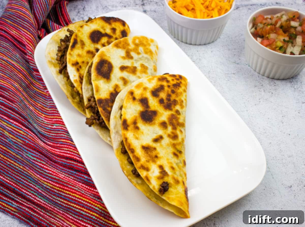 13 Easy Dinners That Taste Gourmet 3 Crispy golden Tacos Dorados arranged neatly on a plate, ready to be served.