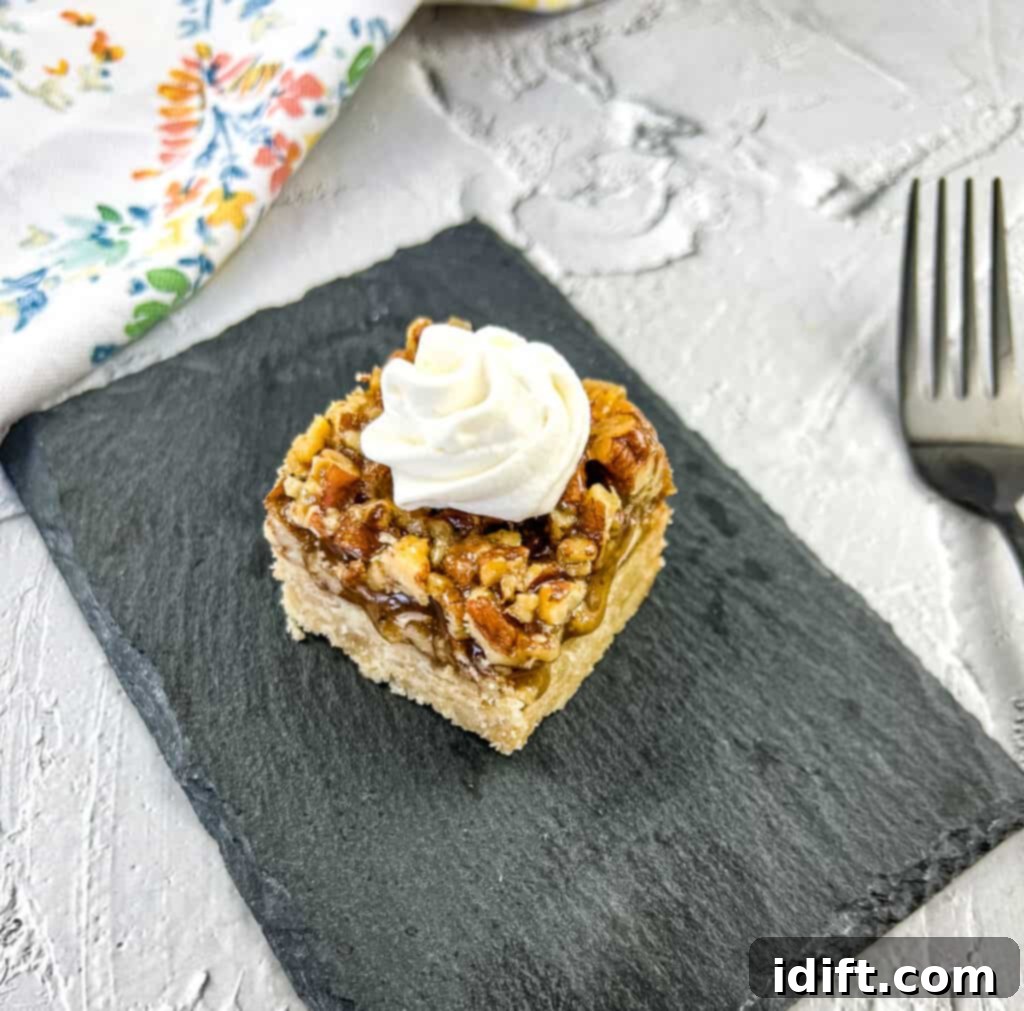 Maple Pecan Pie Bars on a black plate