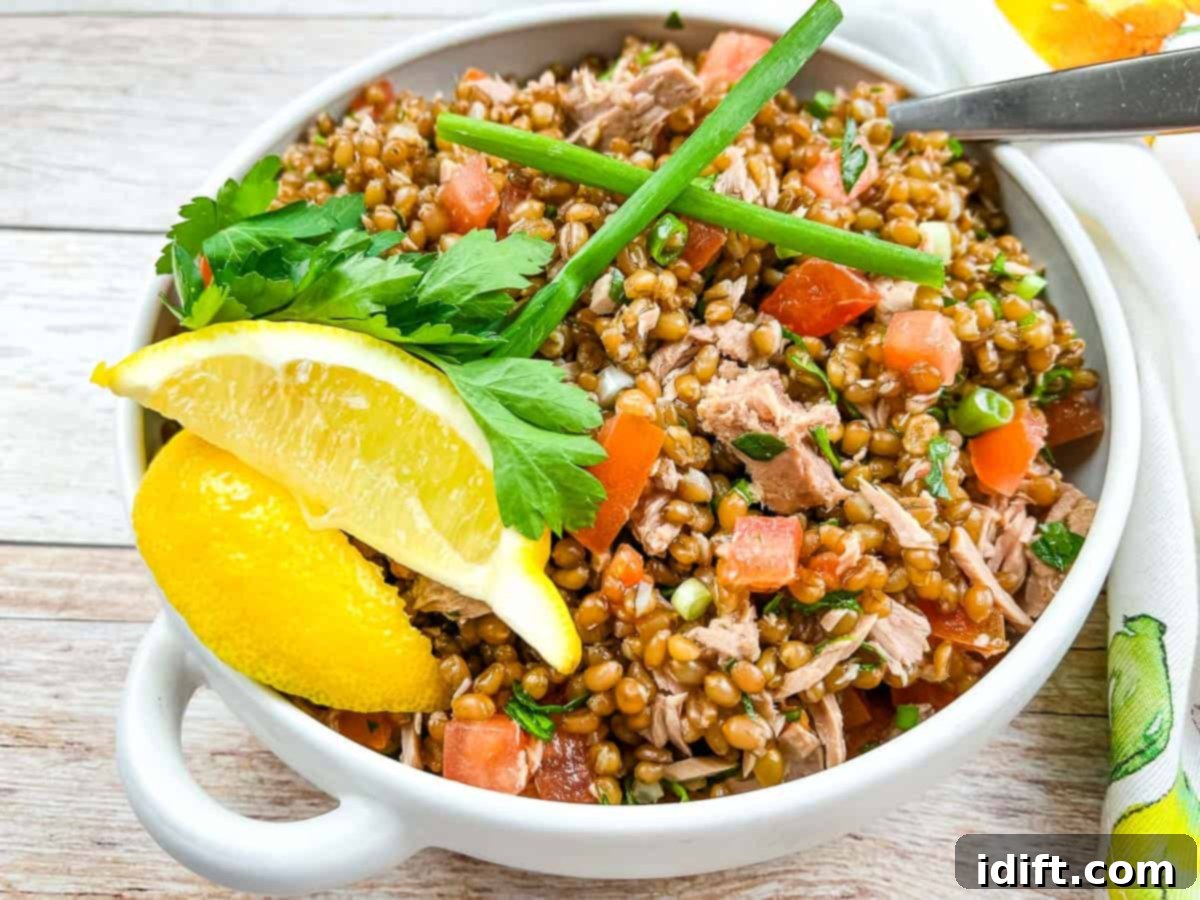Wheat Berry Salad with Tomato & Tuna in a bowl.