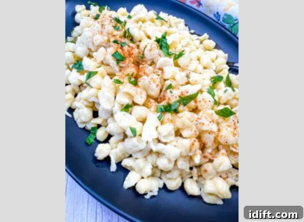 A plate of Authentic German Spaetzle garnished with parsley.
