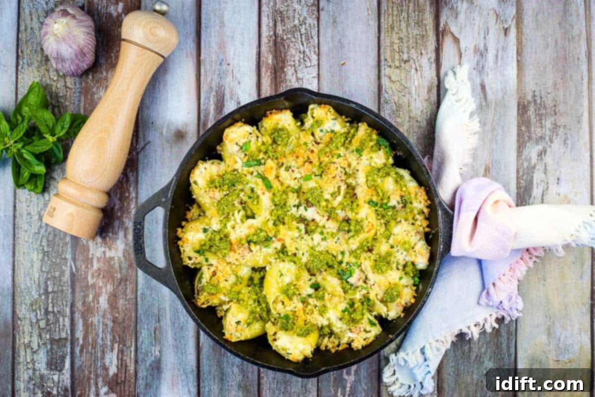 15 Global Cuisines That Will Transform Your Palate 9 Turkey and Pesto Stuffed Pasta Shells in a black cast iron dish.