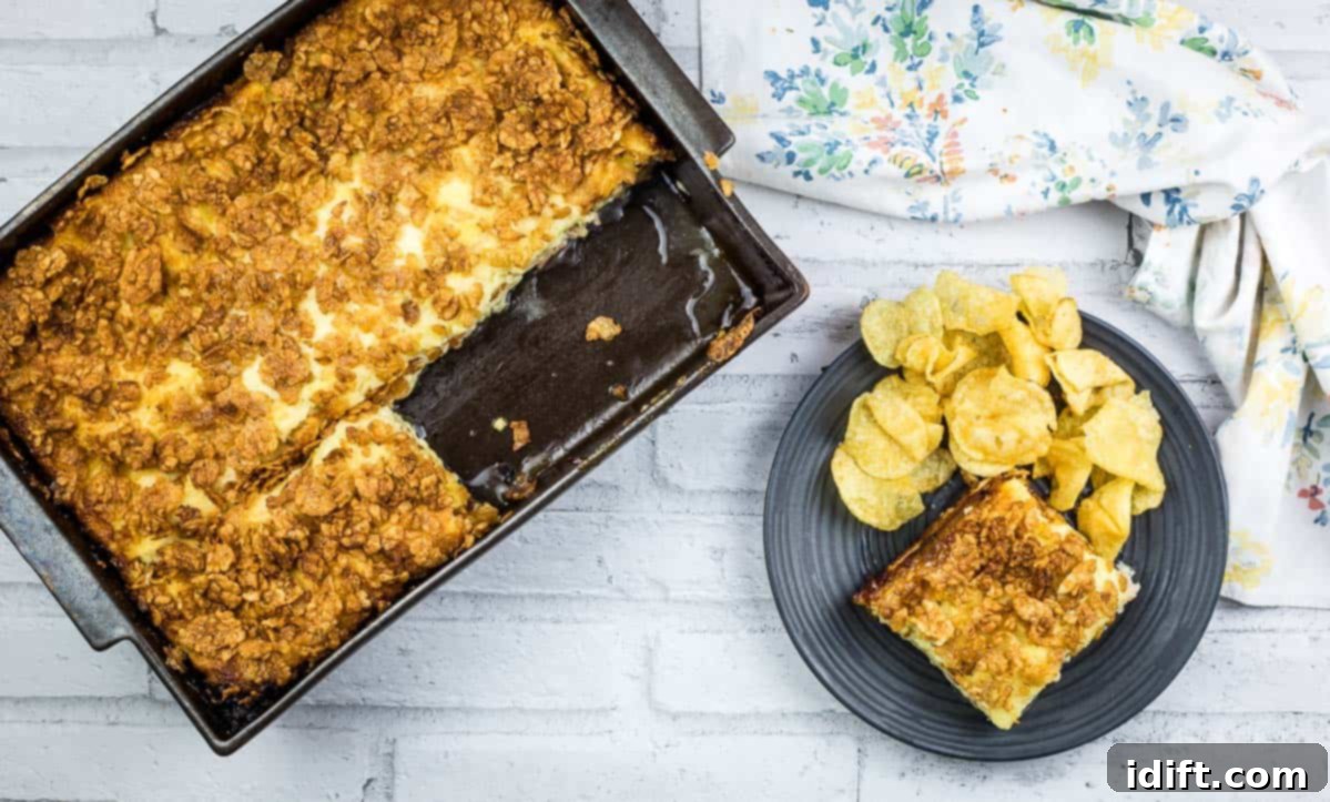 Beyond the Bake: Unlocking the True Might of a Casserole 2 A piece of Cuban sandwich casserole on a plate with potato chips.