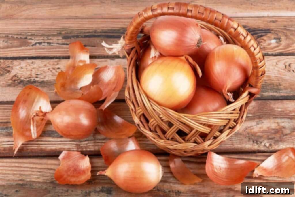 Keep Onions Fresh Longer 4 A basket of whole onions with some scattered onion skins on a wooden surface, suggesting improper handling or storage.