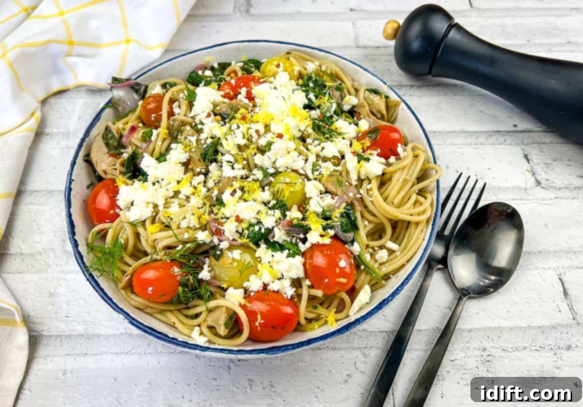 15 Vibrant Spring Dishes That Will Entice You to Dine Al Fresco 8 A bowl of pasta with tomatoes, feta and kalamata olives.