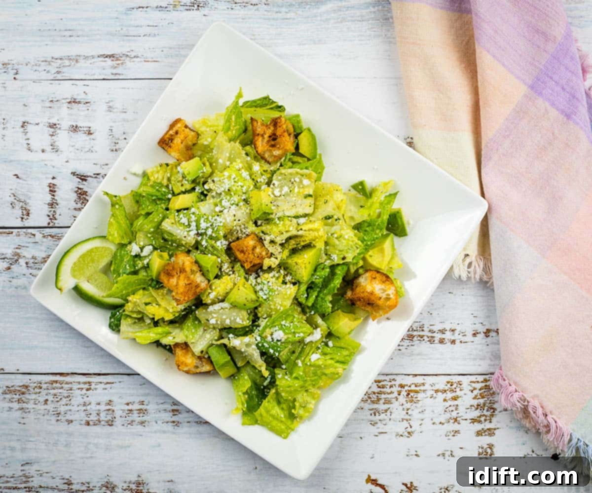 13 Exciting Summer Salads Beyond the Ordinary 6 An image of Tex-Mex Caesar Salad on a square plate.