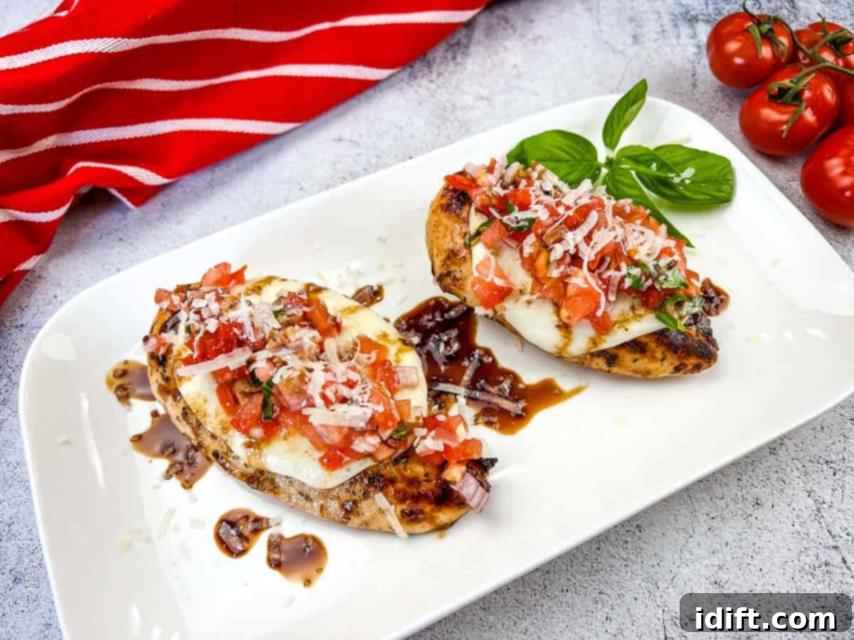 Taste The Heat: 17 Grilling Recipes To Ignite Your Weekend 15 Light and flavorful Grilled Bruschetta Chicken, beautifully topped with fresh, vibrant bruschetta mix, served on a white plate.