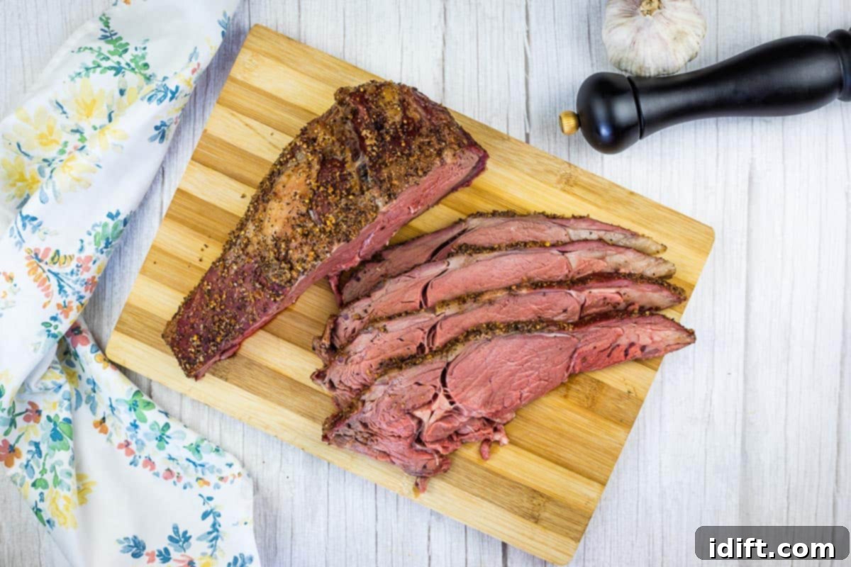 15 Grilled Meats Your Taste Buds Will Thank You For 6 Sliced smoked ribeye beef on a cutting board.