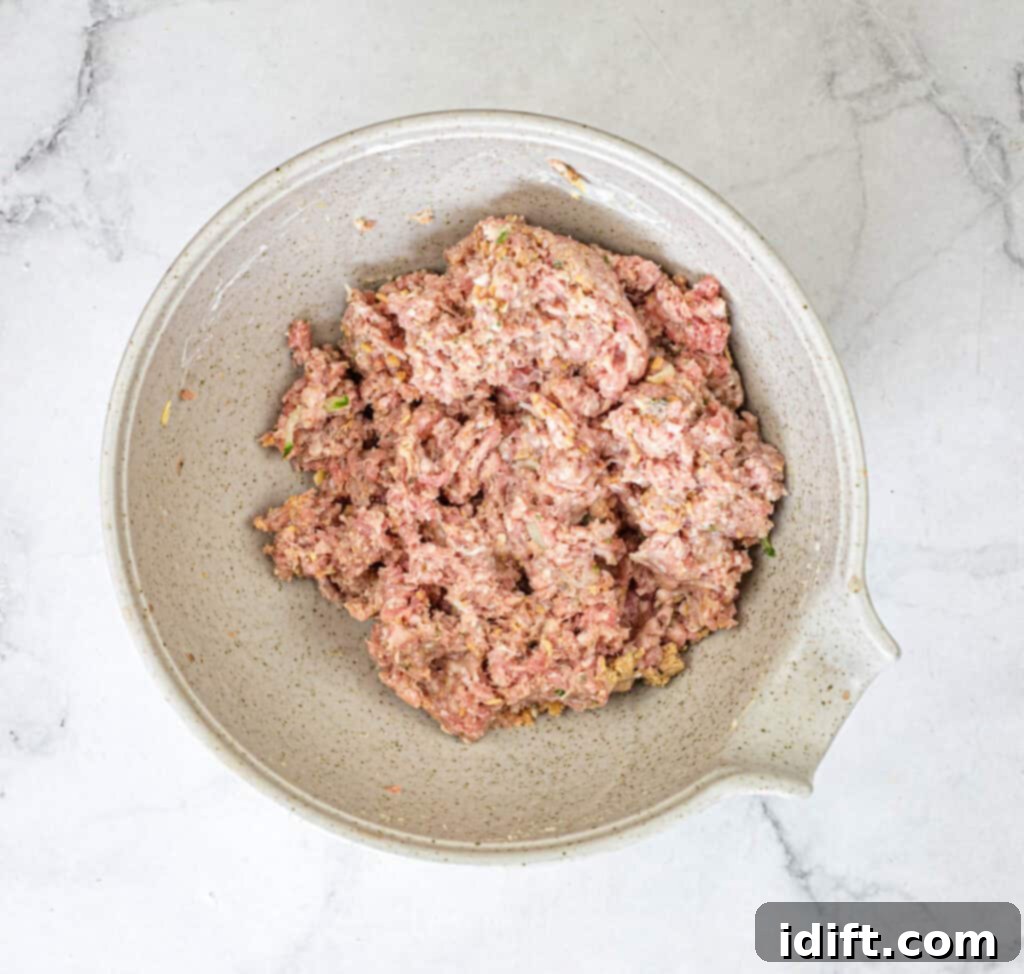Mediterranean Meatball Pita Pockets 7 Thoroughly mixing the meatball ingredients.