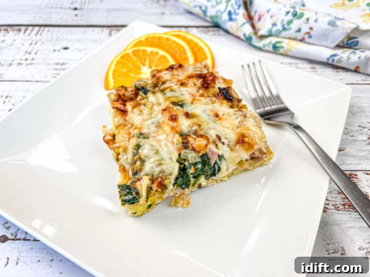 Speedy Suppers, Fabulous Flavors: Family Meals Made Easy 16 A white plate with a slice of Croissant breakfast casserole and orange next to it.