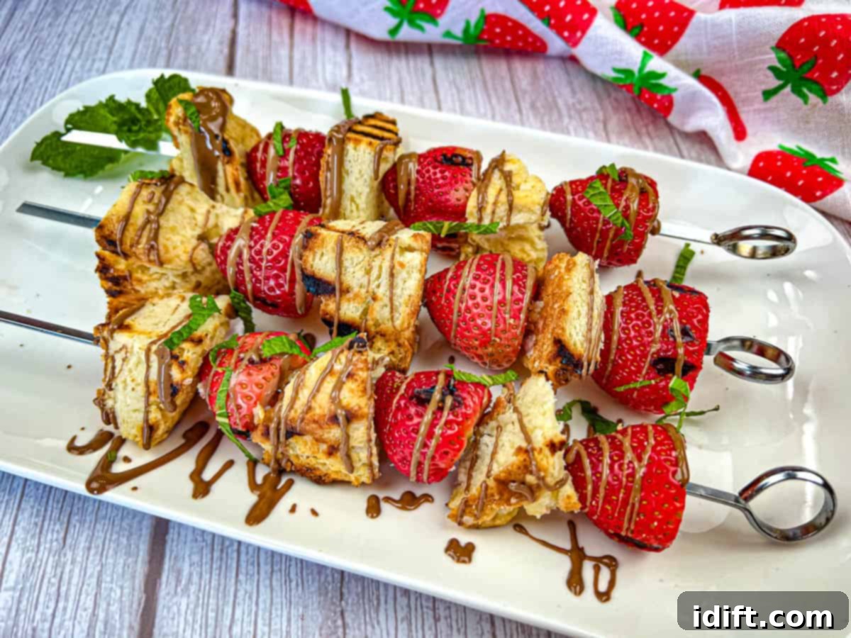 Speedy Suppers, Fabulous Flavors: Family Meals Made Easy 3 Three pieces of Grilled Strawberry Shortcake Skewers on a white plate.