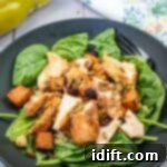 Golden Autumn Salmon Bowl 17 A salmon bowl served on a black plate.